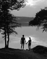 Man And Woman In Bathing Suits Holding Hands Watching Sunset Lakeside Fine Art Print