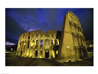 Colosseum lit up at night, Rome, Italy Framed Print