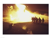 High angle view of firefighters extinguishing a fire Framed Print