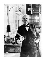 Thomas Edison with the first light bulbs Framed Print