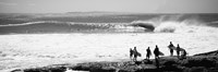 Silhouette of surfers standing on the beach, Australia (black and white) Framed Print