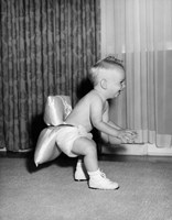 1950sBaby In Diaper And Shoes Learning To Walk Fine Art Print