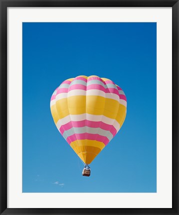 Framed Low angle view of a hot air balloon in the sky, Albuquerque, New Mexico, Yellow &amp; Pink Print