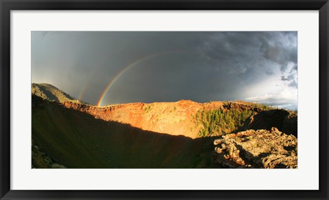 Framed Crater of an extinct volcano with a rainbow in the sky Print