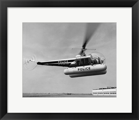 Framed Low angle view of a helicopter in flight, Bell 47-D, Bell Aircraft Corporation Print