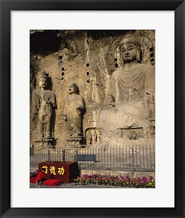 Framed Buddha Statue in a Cave, Longmen Caves, Luoyang, China with Flowers Print