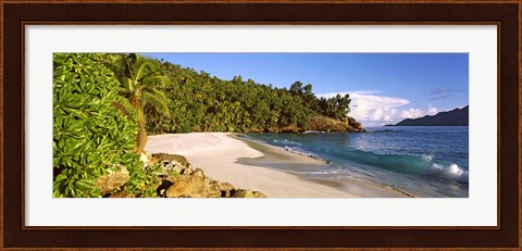 Framed Waves breaking on a small secluded beach on North Island, Seychelles Print