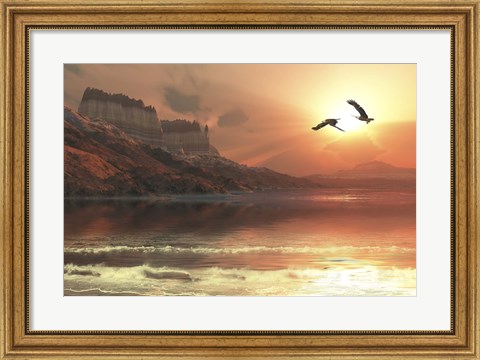 Framed Two Bald Eagles fly along a mountainous coastline at sunset Print