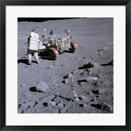 Framed Astronaut walking near the lunar rover on the moon, Apollo 16 Print