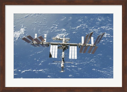 Framed International Space Station Backdropped by a Blue and White Part of Earth Print